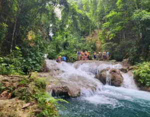 Blue Hole waterfalls in Ocho Rios, Jamaica surrounded by lush tropical greenery