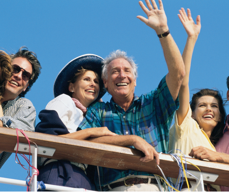 Multi-generational family on a cruise ship, waving.